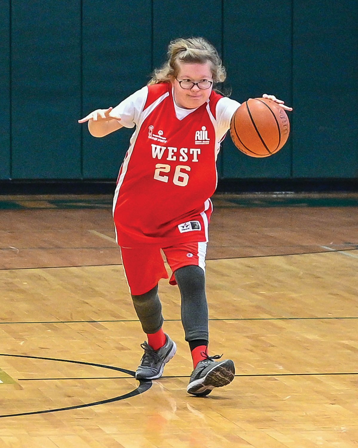 BACK AT IT: Cranston West’s Avery Ream works the ball up the court against Bishop Hendricken last week.